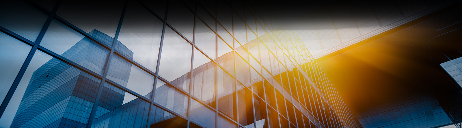 Modern glass corporate building representing business growth and digital transformation