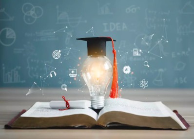 Graduation cap on a glowing light bulb placed on an open book, symbolizing education, knowledge, and innovation