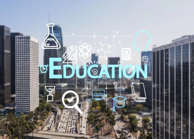 Cityscape with digital education icons overlay representing modern learning and urban development